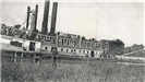 Black and white photo of large steamship on the river, people watching on the bank