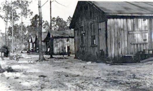 Black and white photo of bunk houses in a row